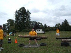 Me attempting the log lift event at an amateur Strongman Competition,